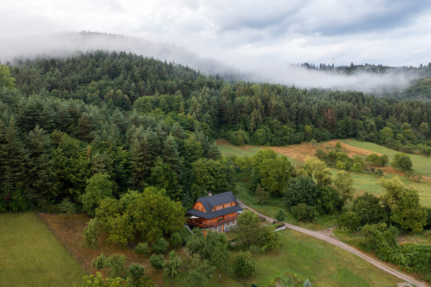 Aerial view of Lubka Lodge and the green valley in summer