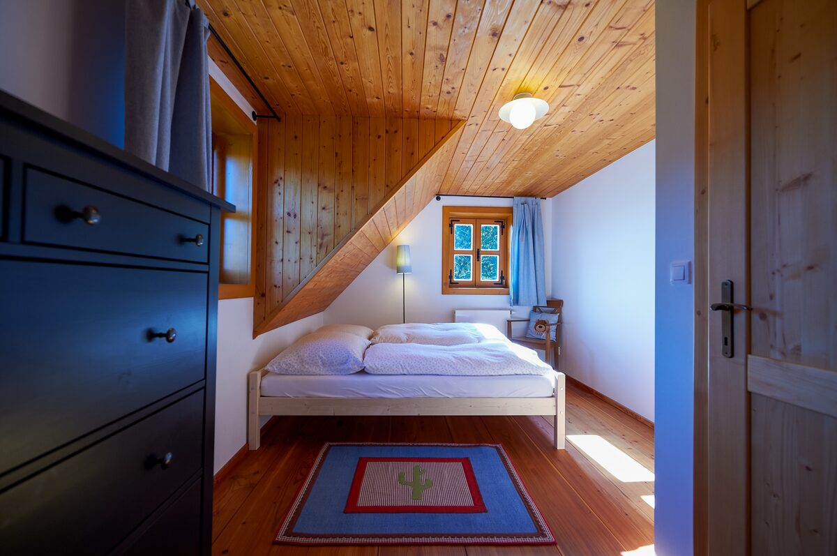 Attic bedroom in warm wood